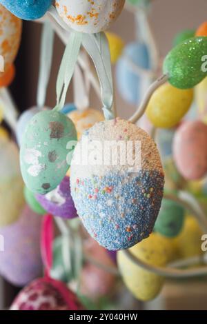 easter concept with multi color egg hanging on a decorative tree  Stock Photo