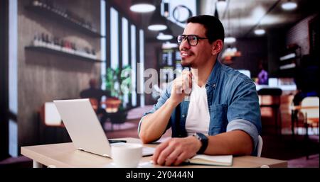 Analyst Businessman Thinking In Coffee Shop While Using Corporate Laptop Stock Photo