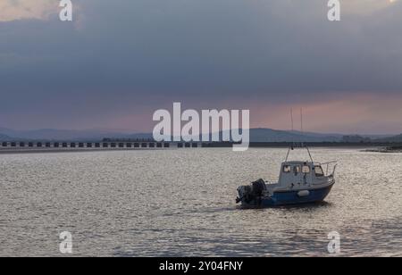 Northern Rail CAF class195 train crossing Arnside viaduct across the river Kent estuary on the scenic Cumbrian coast railway line Stock Photo