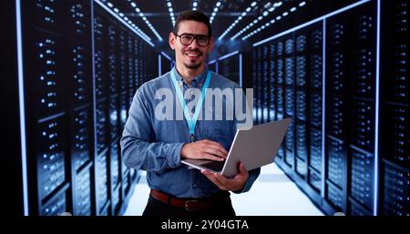 Happy Engineer In Data Center Server Room Configuring AI Technology Stock Photo