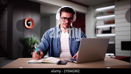 Student College At Home Using Laptop Computer Stock Photo