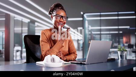 Business Woman Using Mobile Phone Technology And Laptop Stock Photo