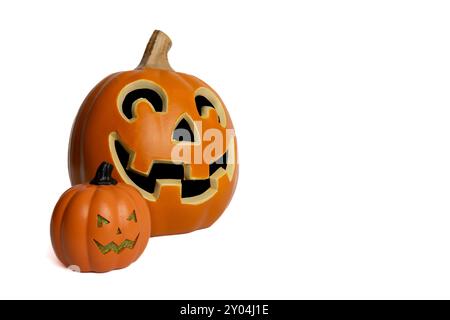 A close-up image of two carved jack-o-lantern pumpkins isolated on a white background. Stock Photo