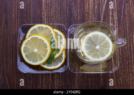 Cup of lemon and honey tea on dark background, top view Stock Photo