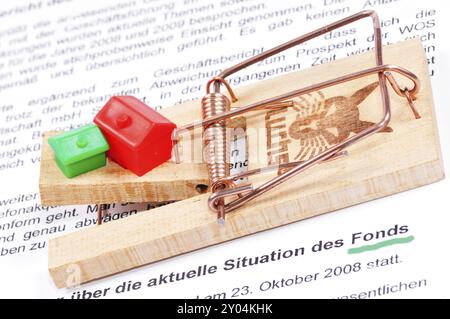 Mausefalle als Symbol. Mousetrap with worldwide as a symbol on a white background Stock Photo