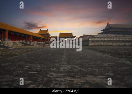 At sunrise, a side gate is seen next to the Hall of Supreme Harmony at the Forbidden City, Imperial Palace complex in Beijing, China, Asia Stock Photo