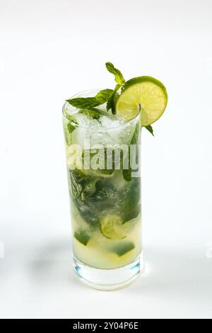 Refreshment Lime juice with mint on white table. Stock Photo