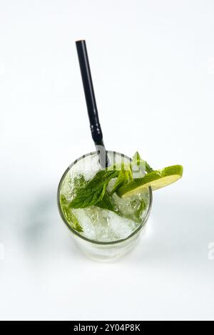 Refreshment Lime juice with mint on white table. Top view. Stock Photo