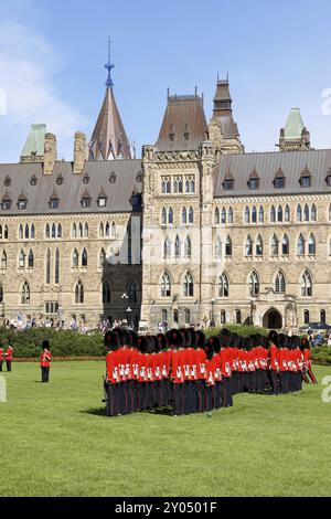 Ottawa, Canada, August 08, 2008: changing of the guard in front of the Parliament of Canada on Parliament Hill in Ottawa, Canada. A lot of tourists at Stock Photo