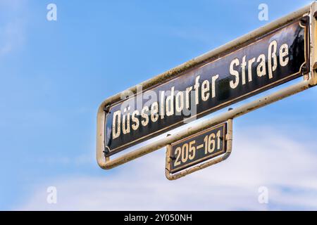 street name sign Dusseldorfer Strae, Dusseldorf Germany against a blue sky Stock Photo