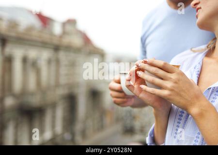 Happy young beautiful couple drinking coffee in the morning Stock Photo