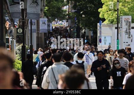 Tokyo - May 2 2023: crowd on the street of street Omotesando, one of famous shopping street in tokyo. Stock Photo