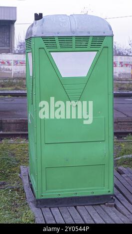 Temporary portable green toilet cabin Stock Photo