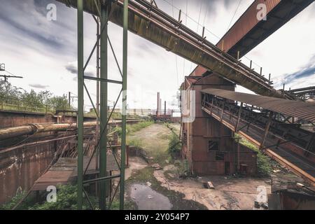 Old industrial site with rusty pipes and abandoned buildings, surrounded by trees, HF4 steelworks, Lost Place, Dampremy, Charleroi, Province of Hainau Stock Photo