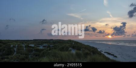 Sunset on a sandy beach with dunes, Buren, Ameland Island, Friesland, Netherlands Stock Photo