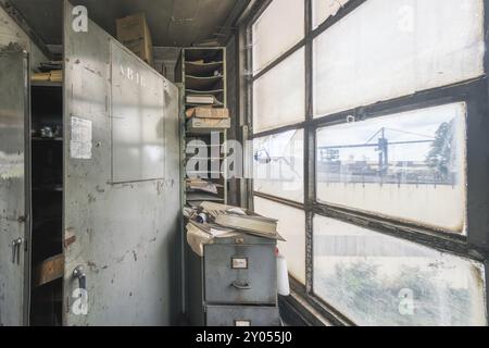 Abandoned interior of an industrial building with old files and broken window, steelworks HF4, Lost Place, Dampremy, Charleroi, Province of Hainaut, B Stock Photo