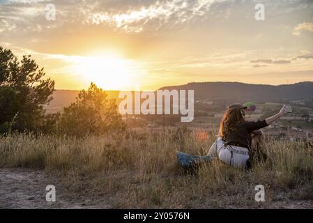 Middle-aged Caucasian couple enjoying a sunny day in the park, walking hand in hand through lush greenery, smiling and bonding in a serene and picture Stock Photo