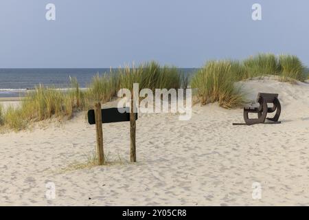 Sand dune with bench to enjoy the view, near Oerd, Ameland Island, Friesland, Netherlands Stock Photo