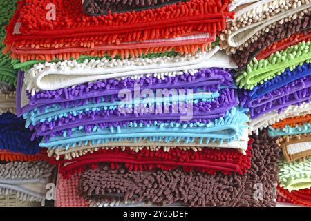 Pile of colorful bathroom rugs and floor mats Stock Photo