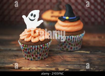 Halloween design homemade cupcakes on dark background Stock Photo