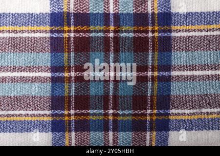 Colorful autumn checkered knitted fabric texture background close up macro Stock Photo