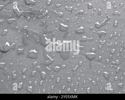 Water drops on quiet gray colored metallic surface Stock Photo