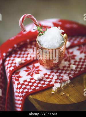 Cold Moscow Mules cocktail with ginger beer, vodka, lime and ice on the plaid background Stock Photo