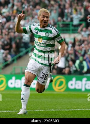 Celtic's Daizen Maeda (L) celebrates after scoring in the first half of ...