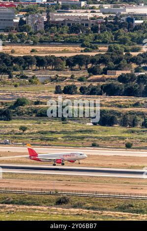 Madrid, Spain; 05-18-2024: Airbus A320 model airplane of the Spanish company Iberia with the landing gear deployed landing on the airport runway Stock Photo