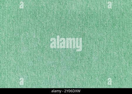 Closeup, macro of green jeans denim fabric texture background. Diagonal weaving jean cloth, canvas. Textile for decor, upholstery, garment. Wallpaper, Stock Photo