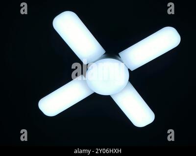A fan shaped LED lamp, LED light is an electric light that produces light using light-emitting diodes, and more energy-efficient than equivalent incan Stock Photo