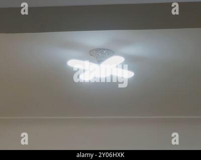 A fan shaped LED lamp, LED light is an electric light that produces light using light-emitting diodes, and more energy-efficient than equivalent incan Stock Photo
