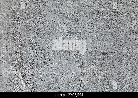 Gray concrete wall, background. The texture of the old wall with plaster and gray whitewash with water-based paint. Unsmooth but flat surface in light Stock Photo