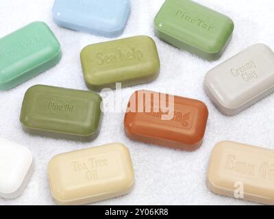 Soap bars with healthy natural ingredients, ginseng, aloe, pine tar, emu oil, tea tree oil, sea kelp, olive oil, pumice on white background Stock Photo