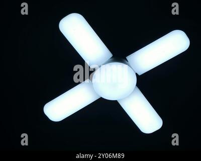 A fan shaped LED lamp, LED light is an electric light that produces light using light-emitting diodes, and more energy-efficient than equivalent incan Stock Photo