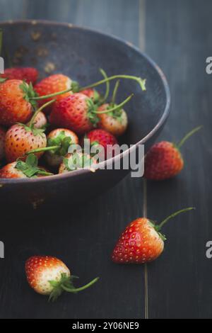 Fresh strawberries on old wooden background. organic fruit background Stock Photo