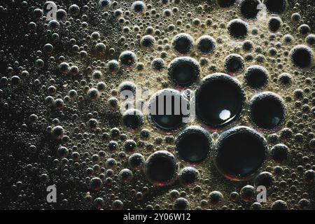 Macro oil bubbles abstract light dark background Stock Photo