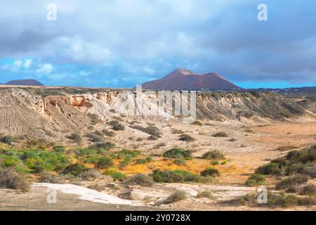 Fuerteventura desert landscape with a mountain in the background, Canary Islands Spain. Vast desert scene showcasing rugged mountains on the island Stock Photo