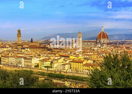 Florence, Italy aerial view of historical medieval houses with Duomo Santa Maria Del Fiore dome in old town and river Arno Stock Photo