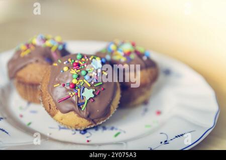 Homemade sweet cupcakes on a plate with colourful decoration Stock Photo