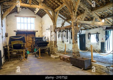 Shibden Hall,West Yorkshire,former home of 'Gentleman Jack'Anne Lister.Coaches in the aisled barn Stock Photo