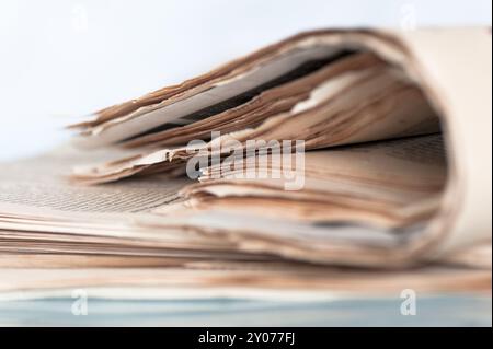 A pile of old yellowed daily newspapers Stock Photo