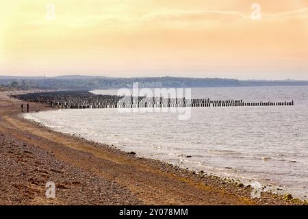 Beach with groynes in the foreground overlooking Heiligendamm, Mecklenburg-Western Pomerania, Germany, Europe Stock Photo