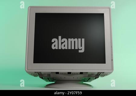 CRT monitor front view of blank display view close-up isolated on blue Stock Photo
