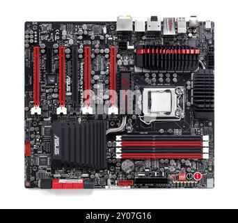 High-end computer motherboard ASUS Maximus V Extreme designed for overclocking with Intel i7 processor isolated on white background Stock Photo