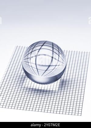 Abstract crystal ball on checked surface showing refraction Stock Photo