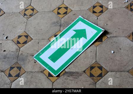 Sign on the dirty floor of a disused factory Stock Photo