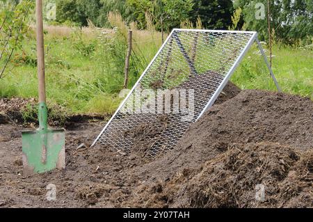 Sieve compost pile, compost pile sieve 03 Stock Photo