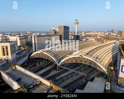 An aerial view of Liverpool Lime Street railway station with the city skyline in the background. Stock Photo