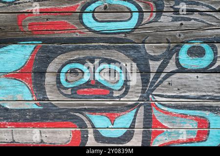 Alaska, Haines. Noow Hit Tribal House, last remaining Tlingit traditional structure constructed in the Chilkat Valley. Colorful exterior wall detail. Stock Photo